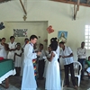 Fr Juan Giving Communion